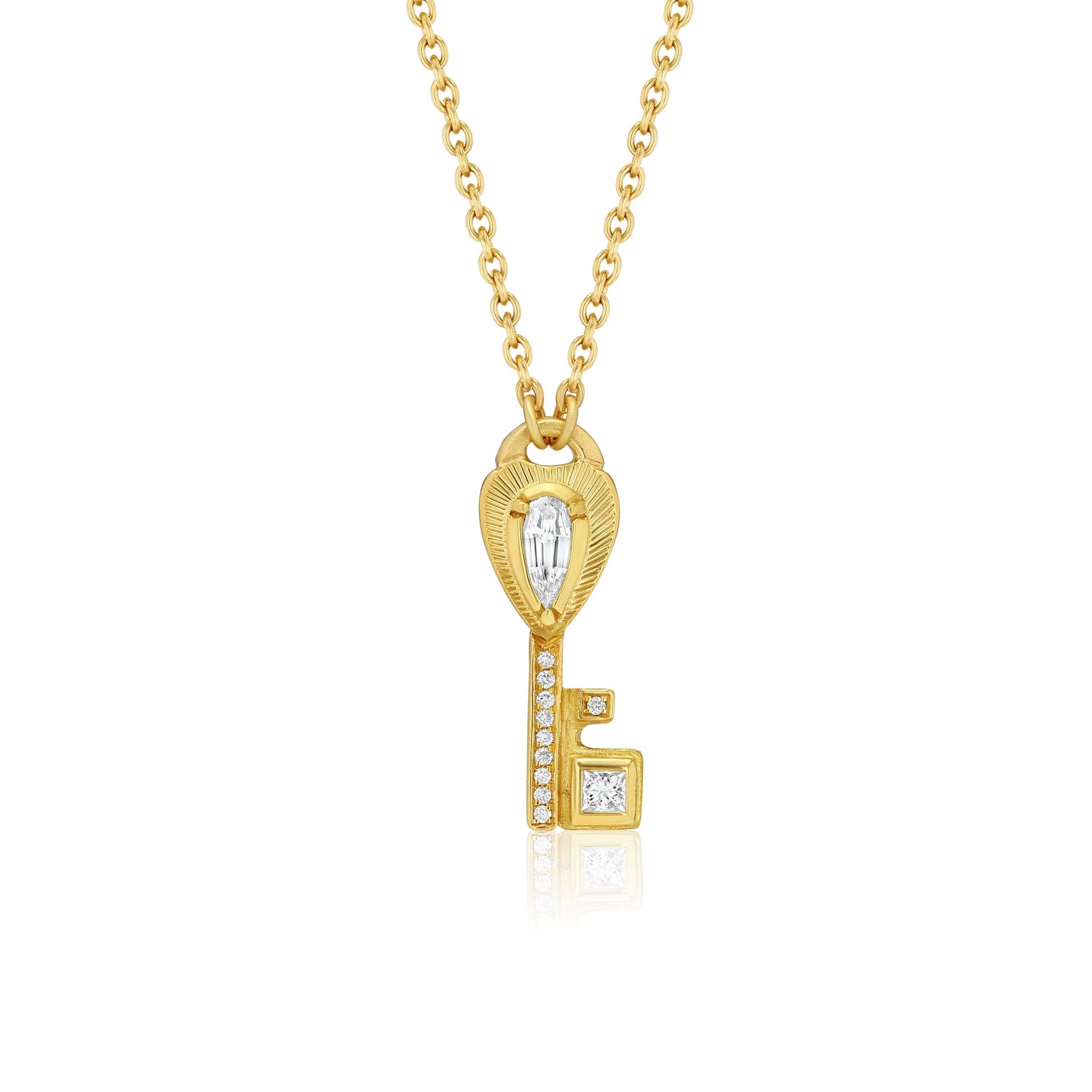 One of a kind 18k gold teardrop diamond heart key necklace with princess cut and full cut diamond pave from Los Angeles jewelry designer Brooke Gregson.