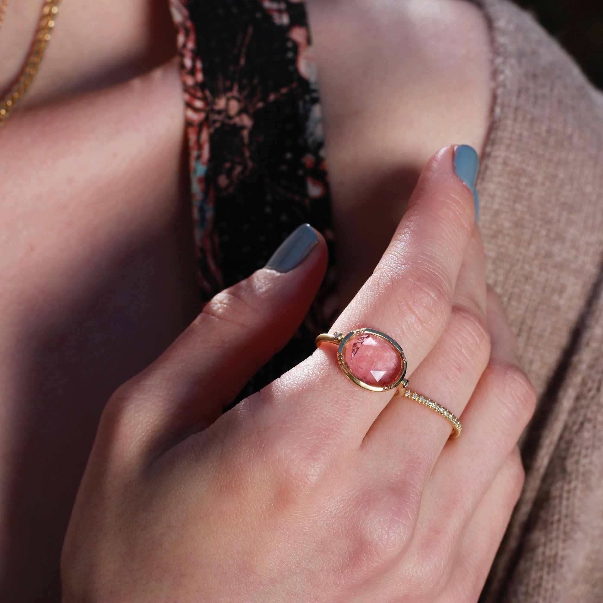 Hand wearing 18k gold pink tourmaline ring from Los Angeles jewelry designer Brooke Gregson handmade in London