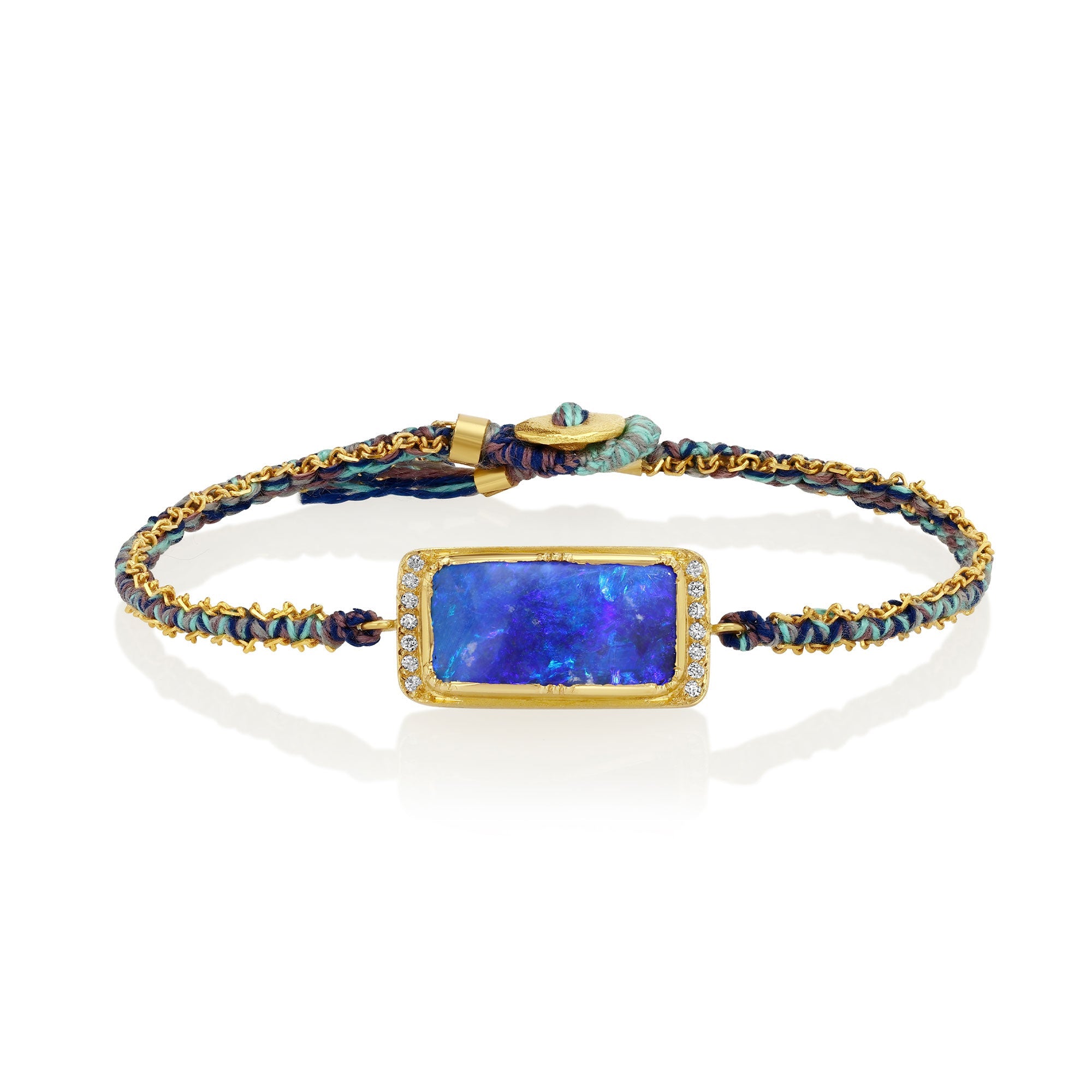 Silk bracelet with blue boulder opal stone and gold chain on a white background
