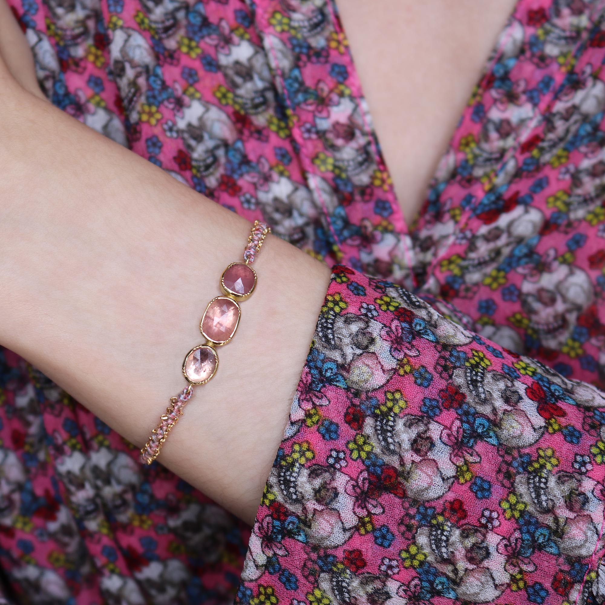 Model wearing one of a kind pink Sapphire bracelet with hand woven silk and 18k gold chain from Los Angeles jewelry designer Brooke Gregson.