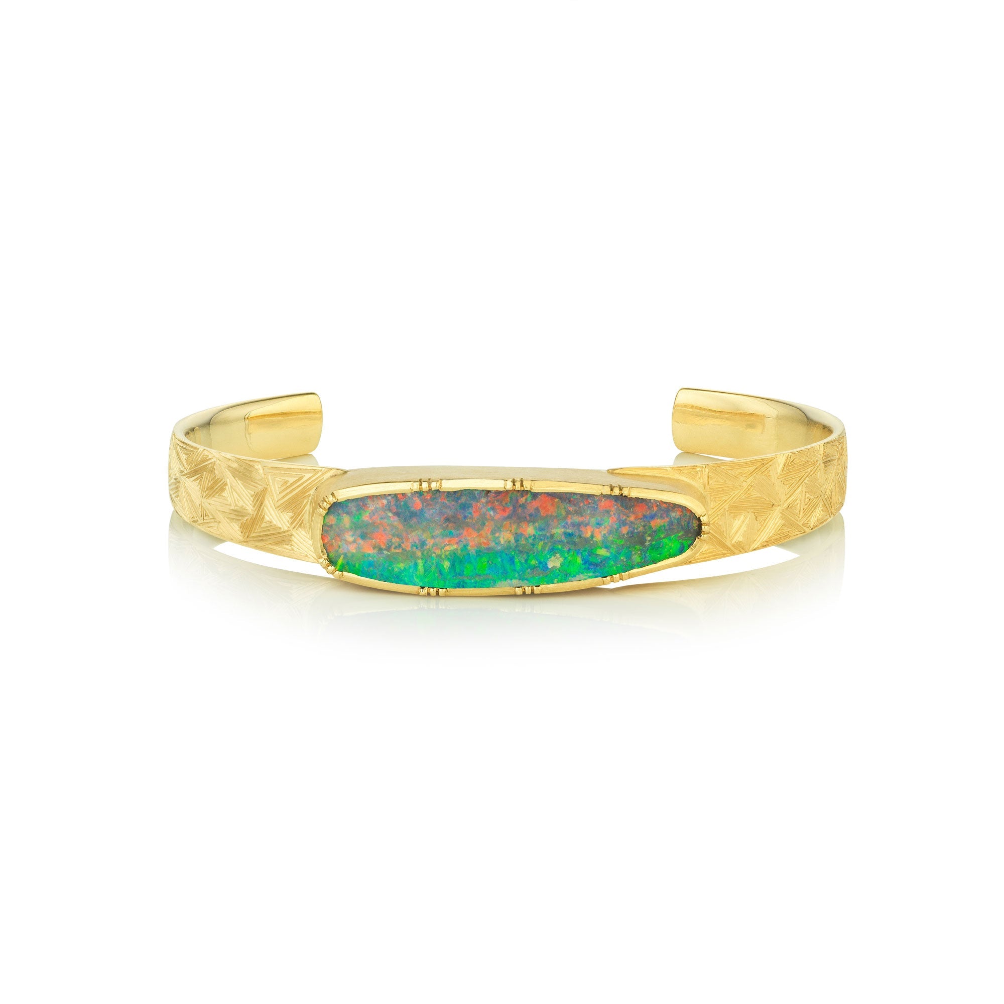 Gold engraved cuff bracelet with a Boulder Opal stone on a white background