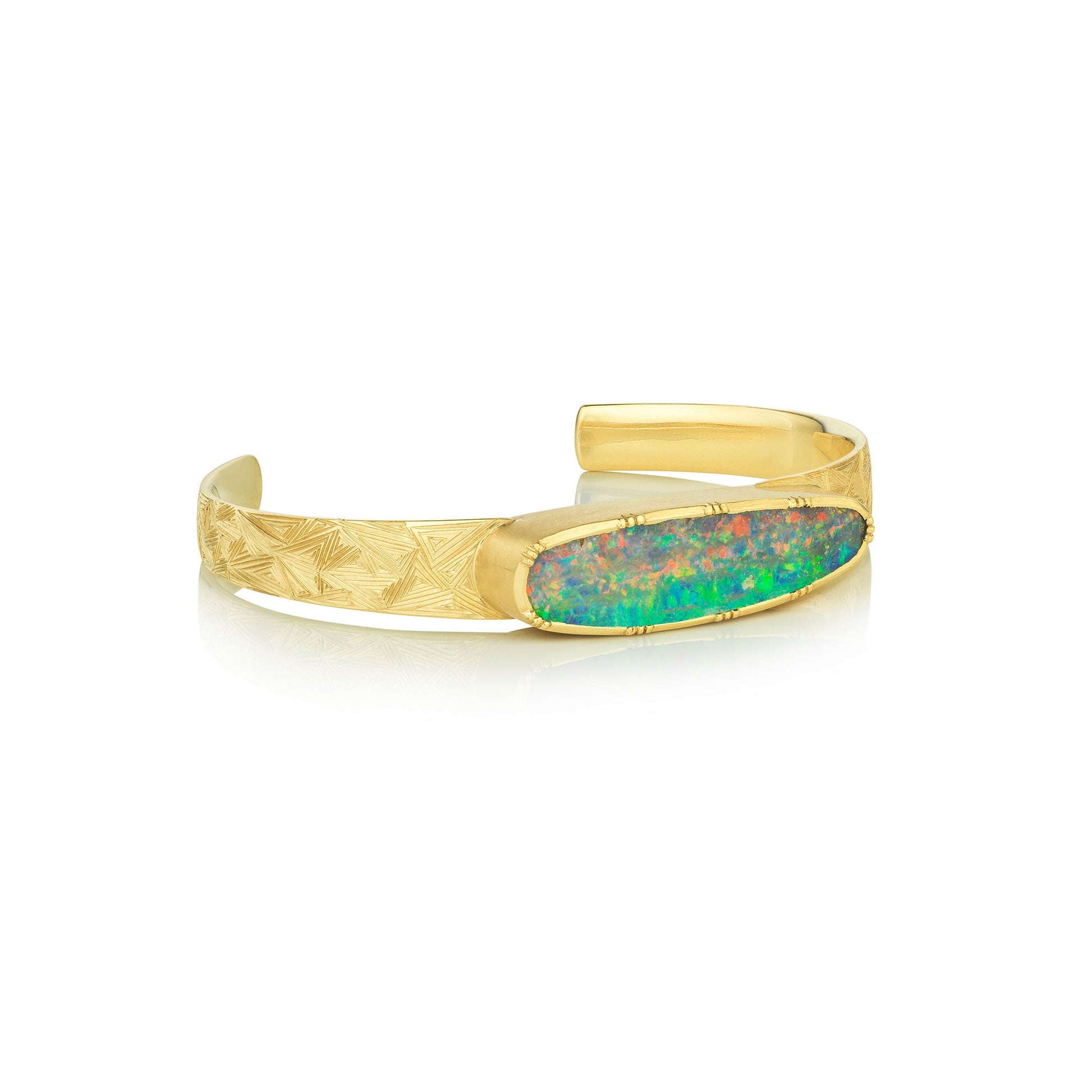 Gold bracelet with an opal stone on a white background