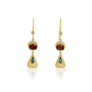 Gold earrings with green and red tourmalines on a white background