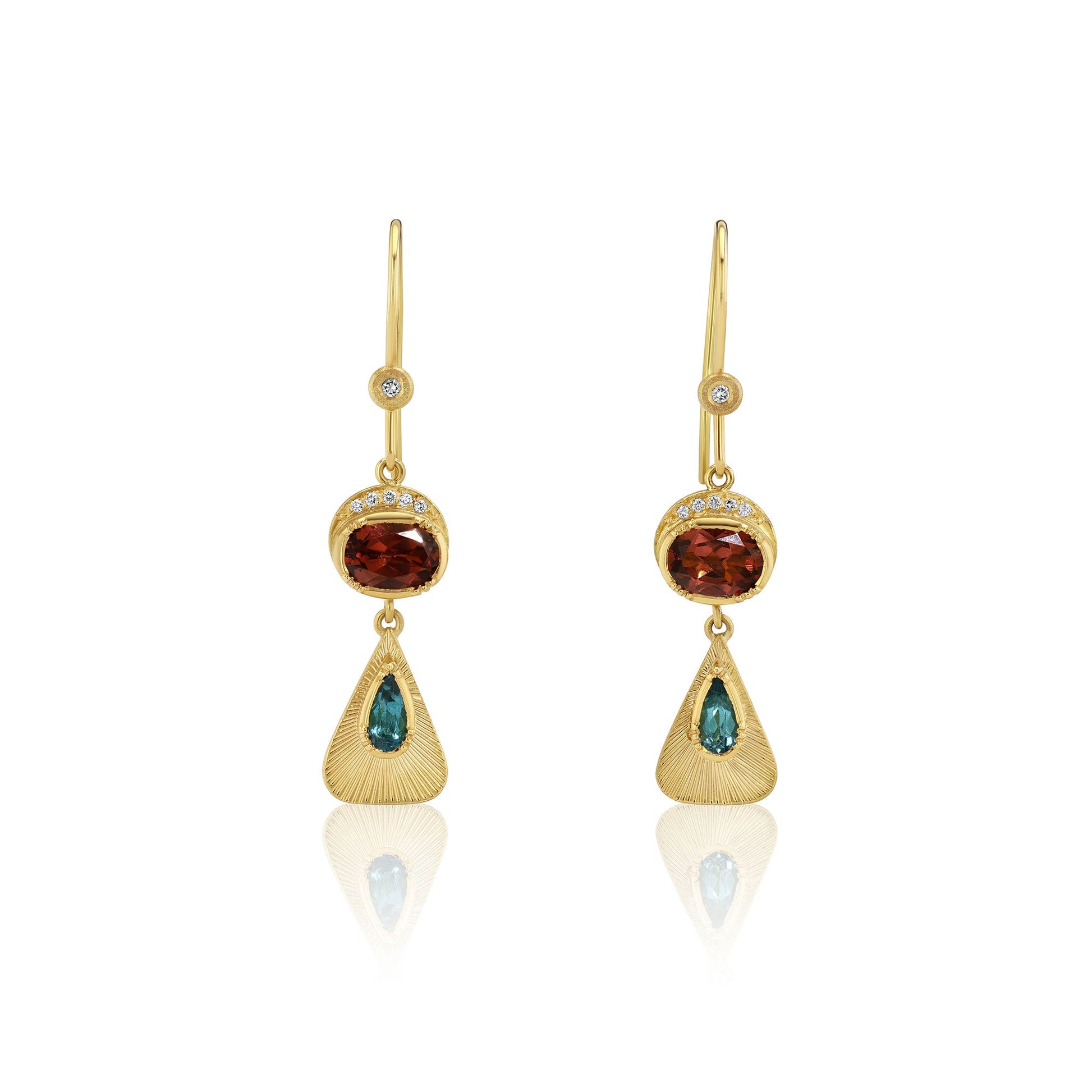 Gold earrings with green and red tourmalines on a white background