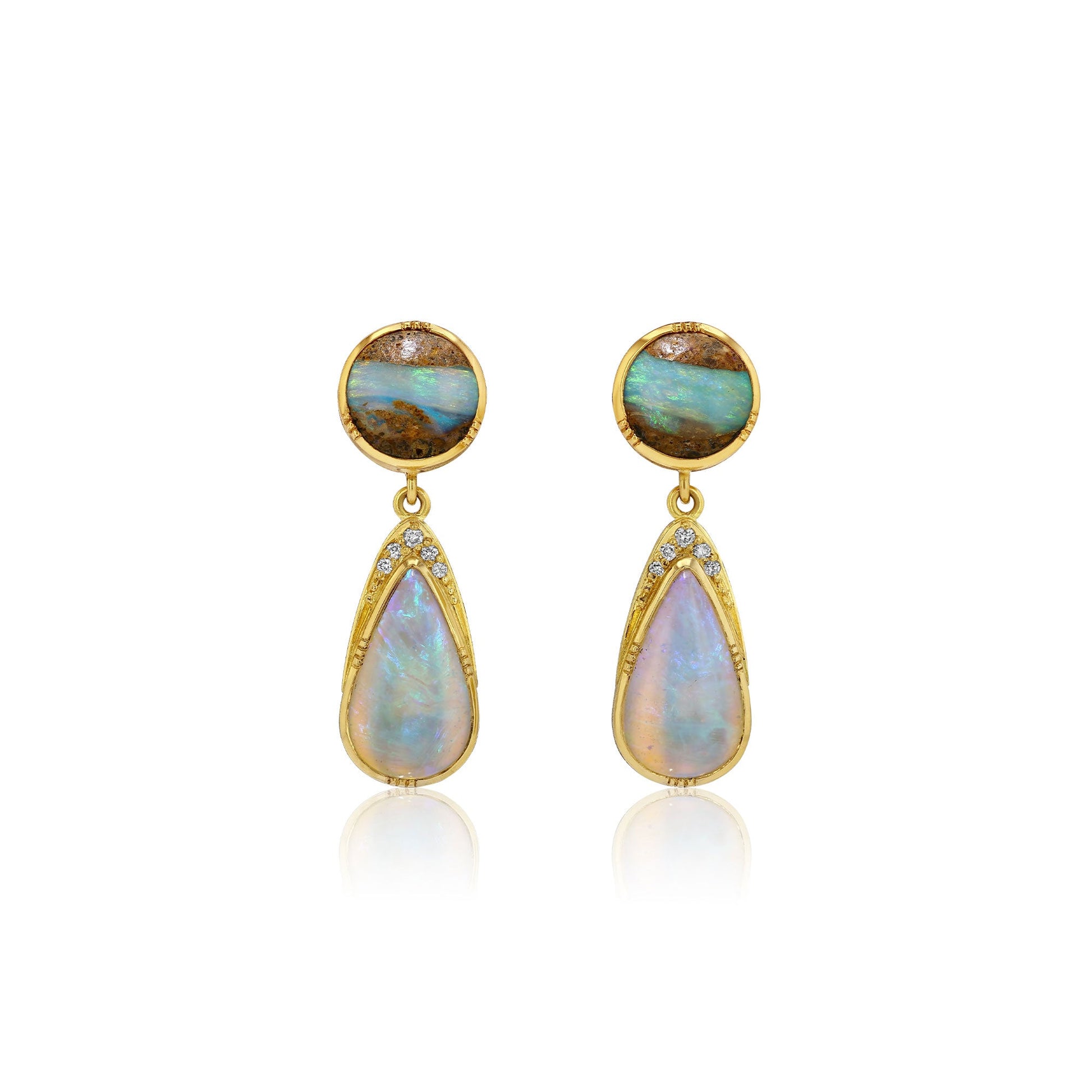 A pair of gold drop earrings featuring round cabochon opal stones at the top and teardrop-shaped opal drops below, accented with small clear stones, set against a plain white background.