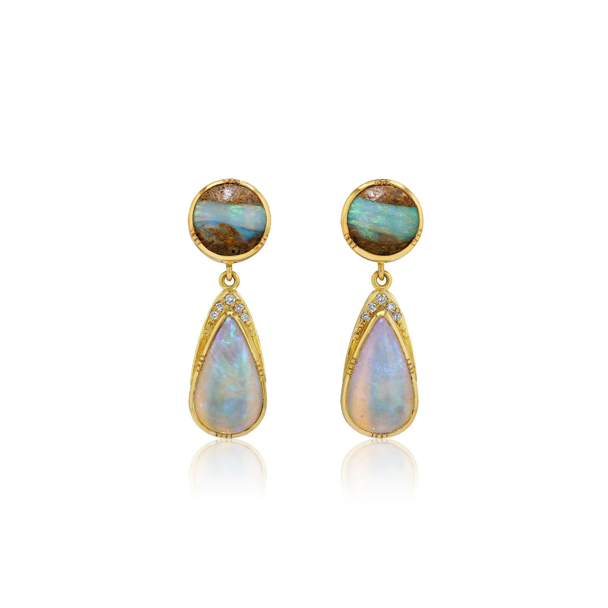A pair of gold drop earrings featuring round cabochon opal stones at the top and teardrop-shaped opal drops below, accented with small clear stones, set against a plain white background.