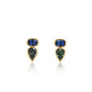 Pair of earrings with blue gemstones and gold accents on a white background
