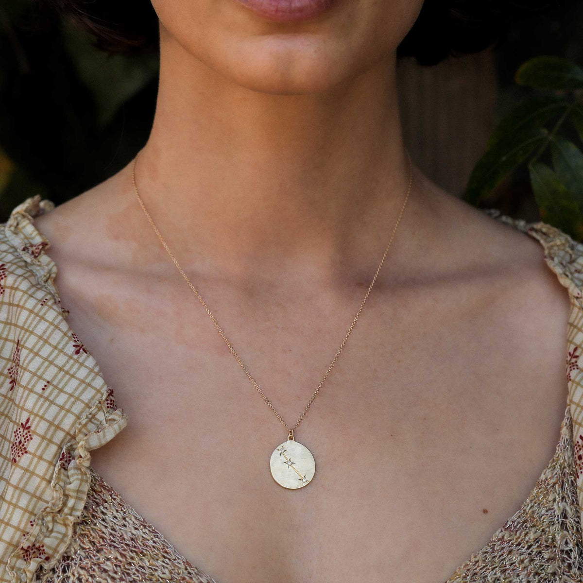 Model wearing Hand made in Los Angeles Brooke Gregson 14k gold Aries Astrology Necklace with Diamond Star sign constellation