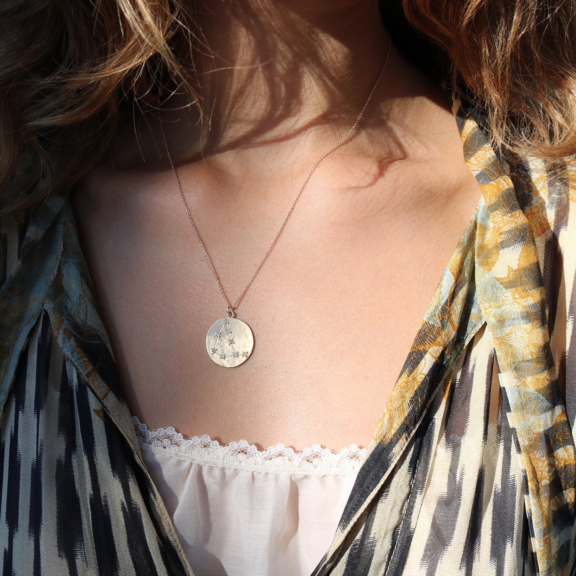 Model wearing Hand made in Los Angeles Brooke Gregson 14k gold Astrology Zodiac Capricorn Diamond Star Sign Necklace