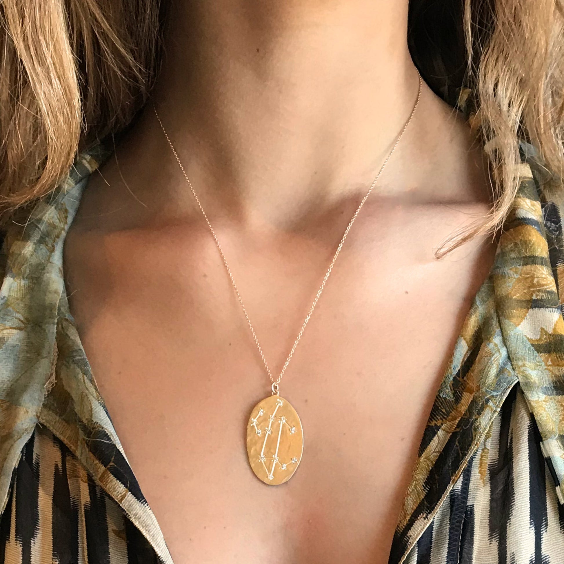 Model wearing Hand made in Los Angeles Brooke Gregson 14k gold Zodiac Astrology Leo Diamond Star Sign Necklace