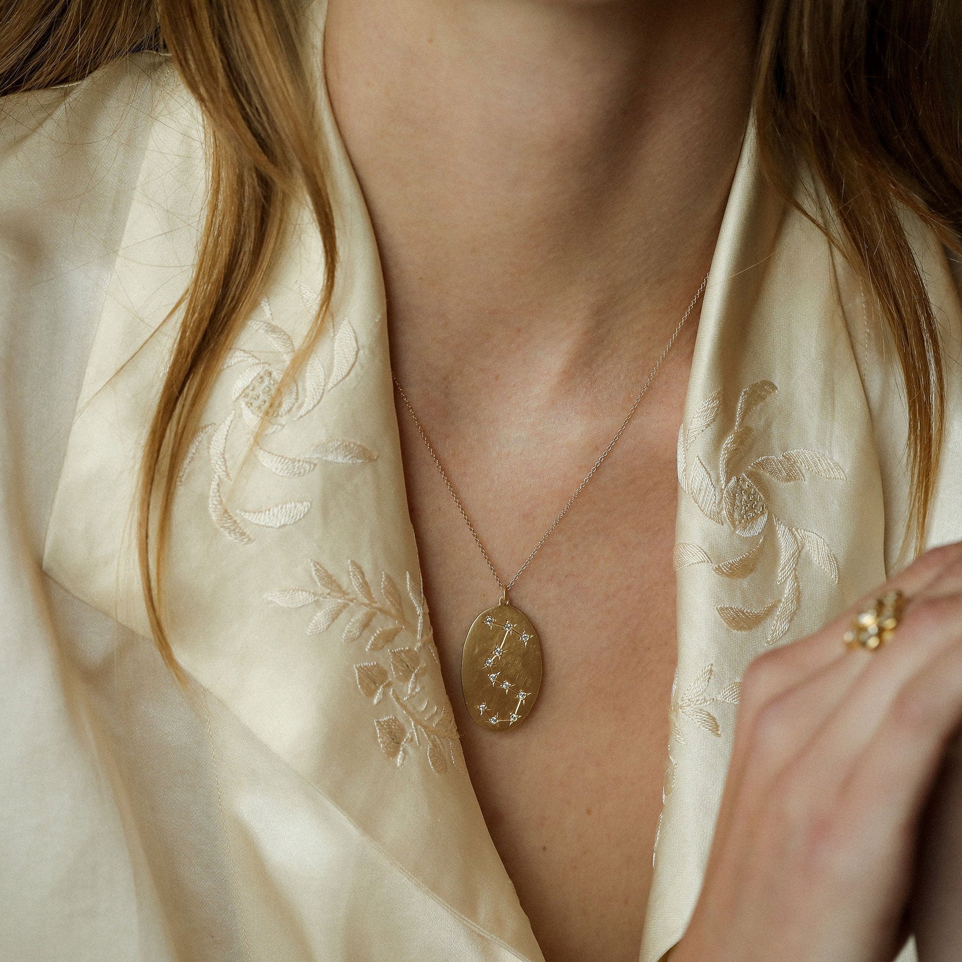 Model wearing hand made in Los Angeles Brooke Gregson 14k Gold Astrology Scorpio Necklace with Diamond Star sign 