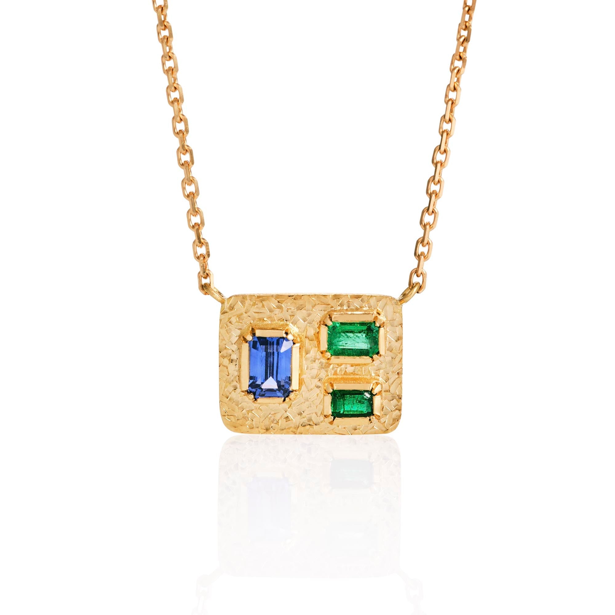 One of a kind 18k gold necklace featuring a geometric design with blue sapphire, emerald and hand engraving from Los Angeles designer Brooke Gregson