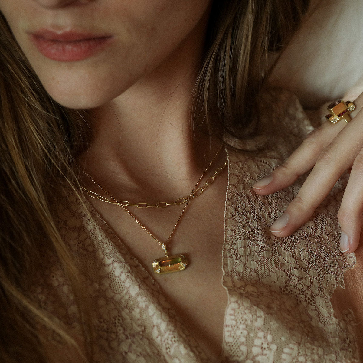Model wearing one of a kind bi-color tourmaline necklace in 18k gold with diamond pave and hand engraving from Los Angeles jewelry designer Brooke Gregson