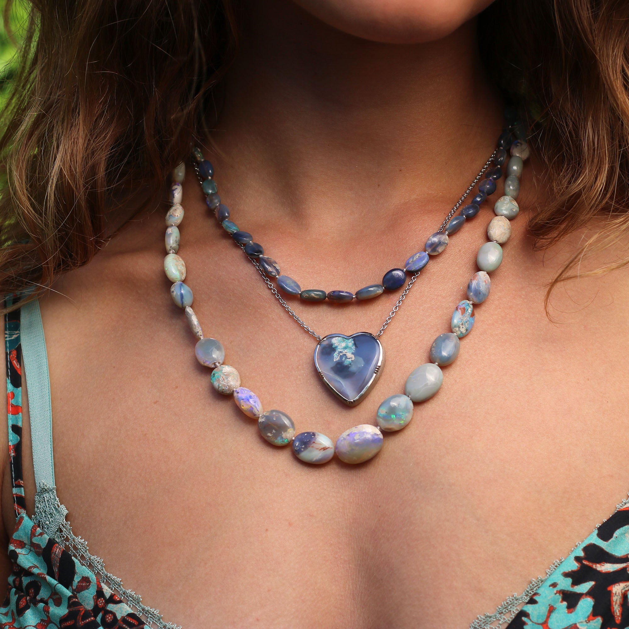 Model wearing one of a kind 18k white gold heart shaped Wood Opal necklace. Fine jewelry hand made in London from Los Angeles designer Brooke Gregson.