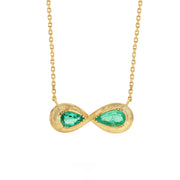 One of a kind 18k gold hand engraved Emerald Infinity necklace from Los Angeles designer Brooke Gregson, dine jewelry handmade in London.