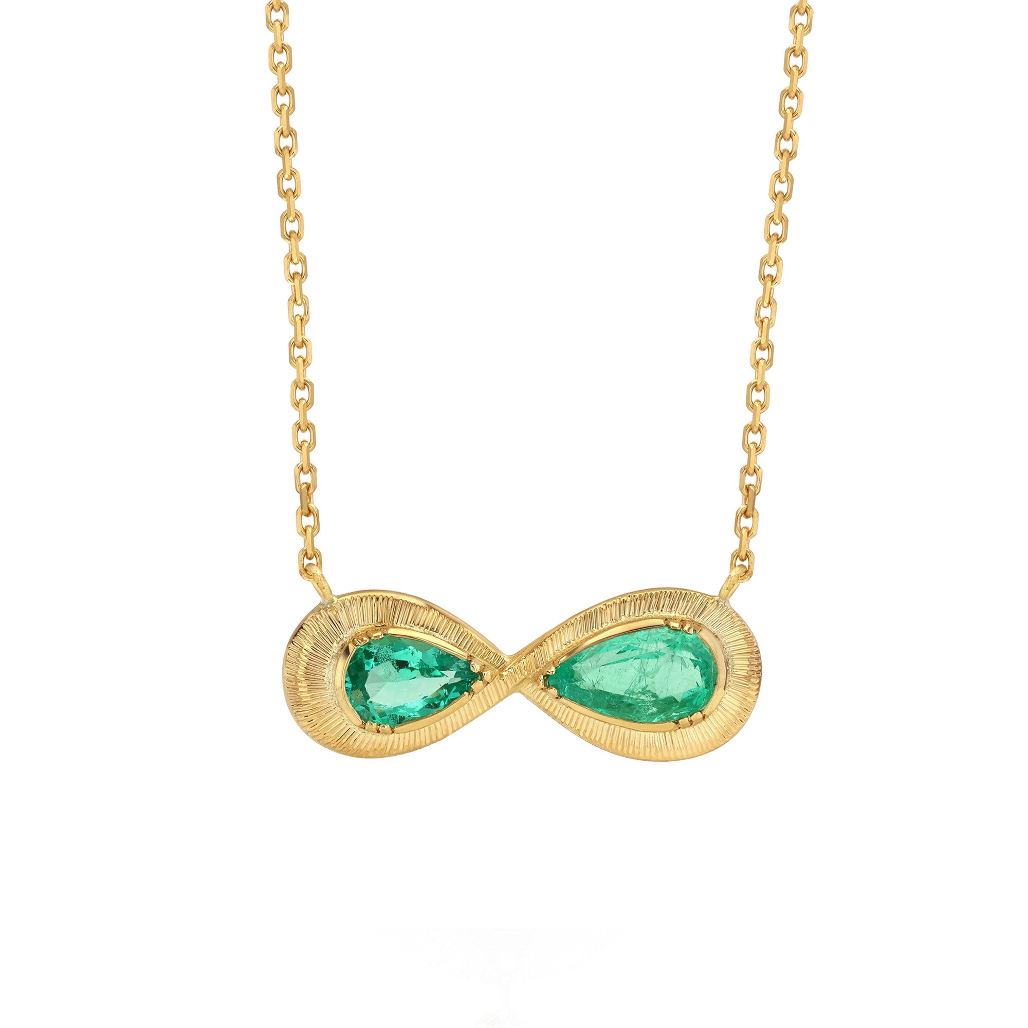 One of a kind 18k gold hand engraved Emerald Infinity necklace from Los Angeles designer Brooke Gregson, dine jewelry handmade in London.