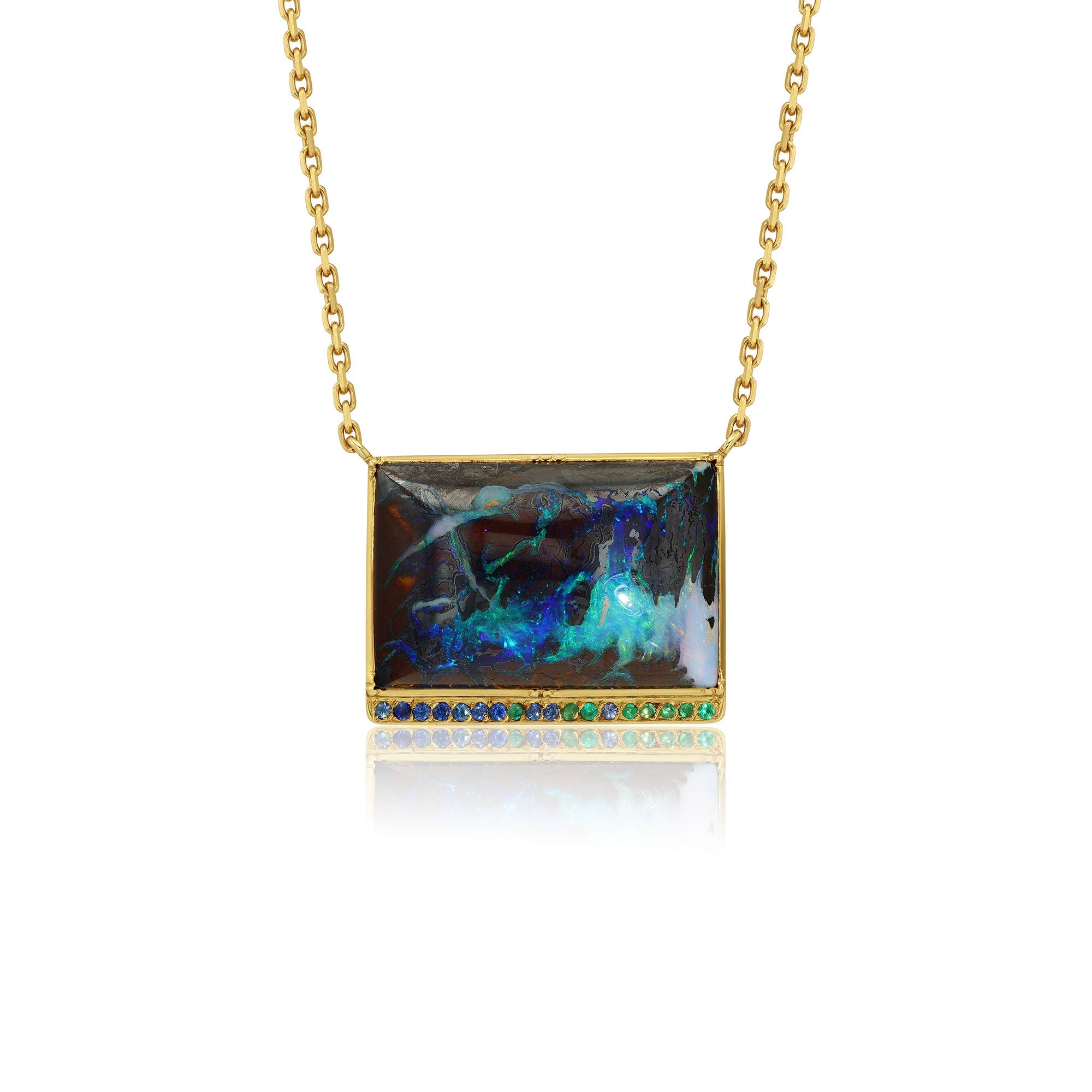 18K gold Necklace with a rectangular yowah nut pendant featuring colorful emerald and sapphire stones on a white background