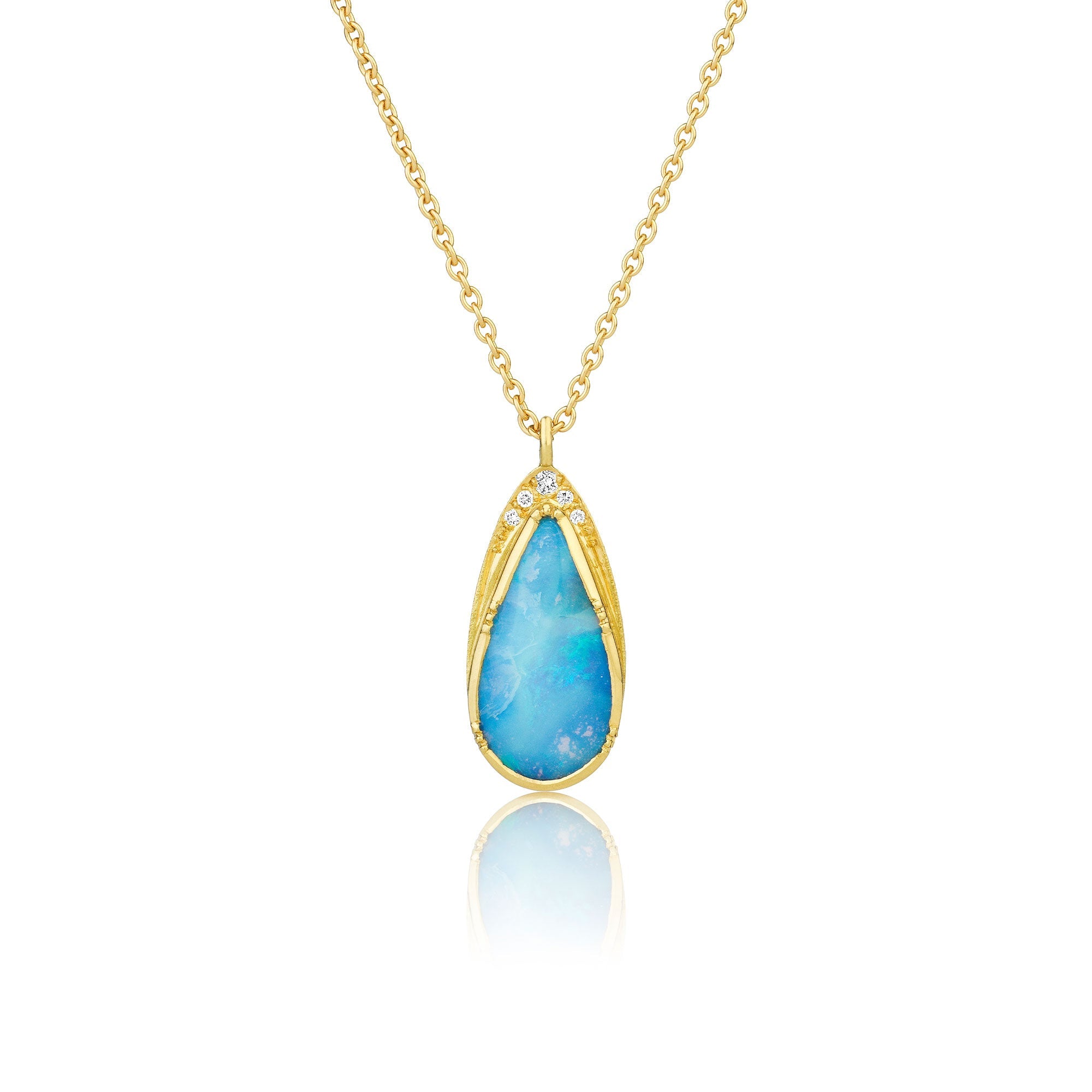18k yellow gold necklace with a blue opal teardrop pendant with white diamond accents on a white background