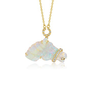 A gold pendant necklace featuring a stylized horse charm made of iridescent white australian opal with small diamond stones, suspended from a delicate gold chain on a white background.