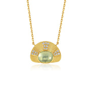A gold pendant necklace featuring a fan-shaped design with a central oval light aquamarine green stone and small clear accent diamond stones, shown on a white background with a soft reflection.