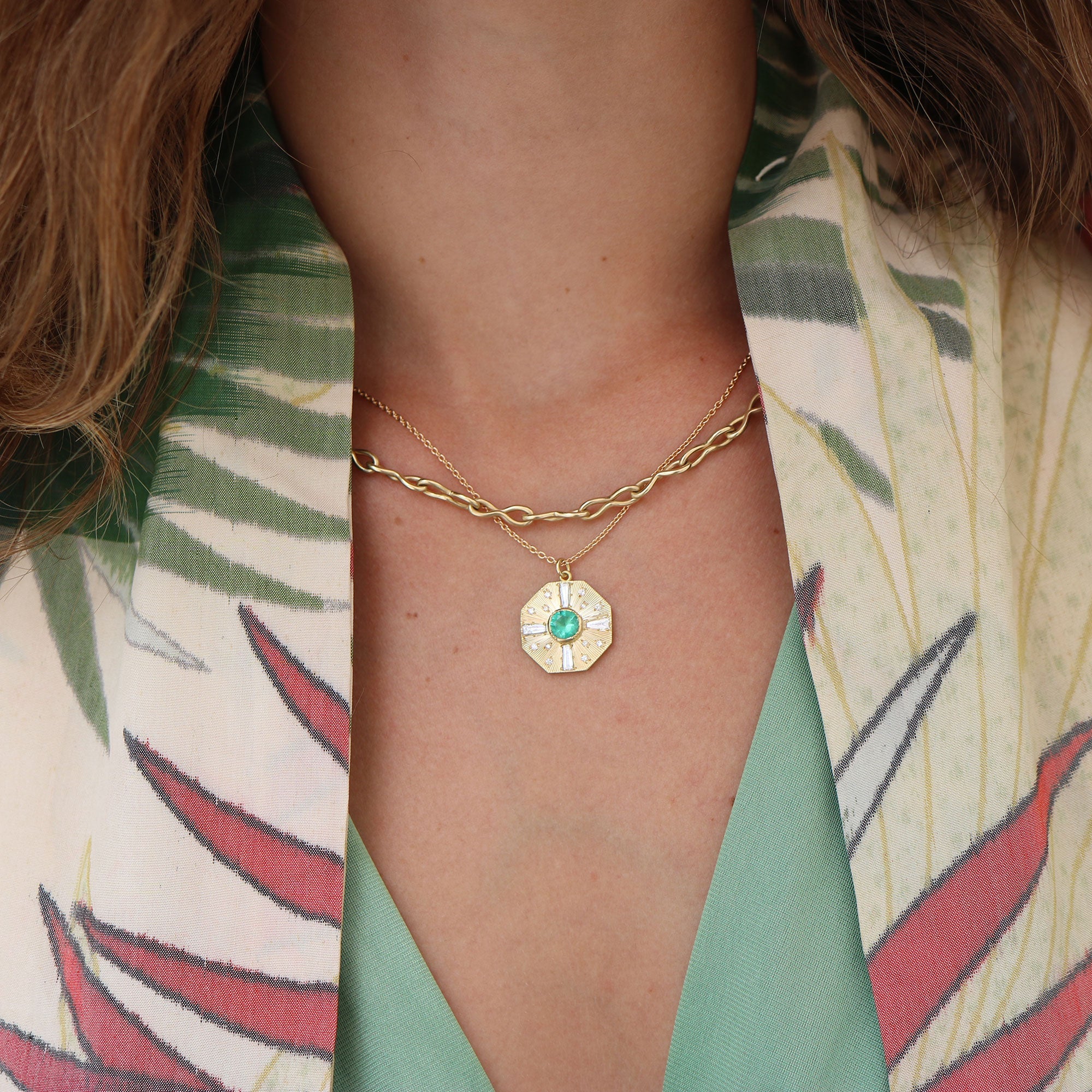 Model wearing One of a kind Emerald and Diamond 18k gold engraved necklace from Los Angeles jewelry designer Brooke Gregson, handmade in London.