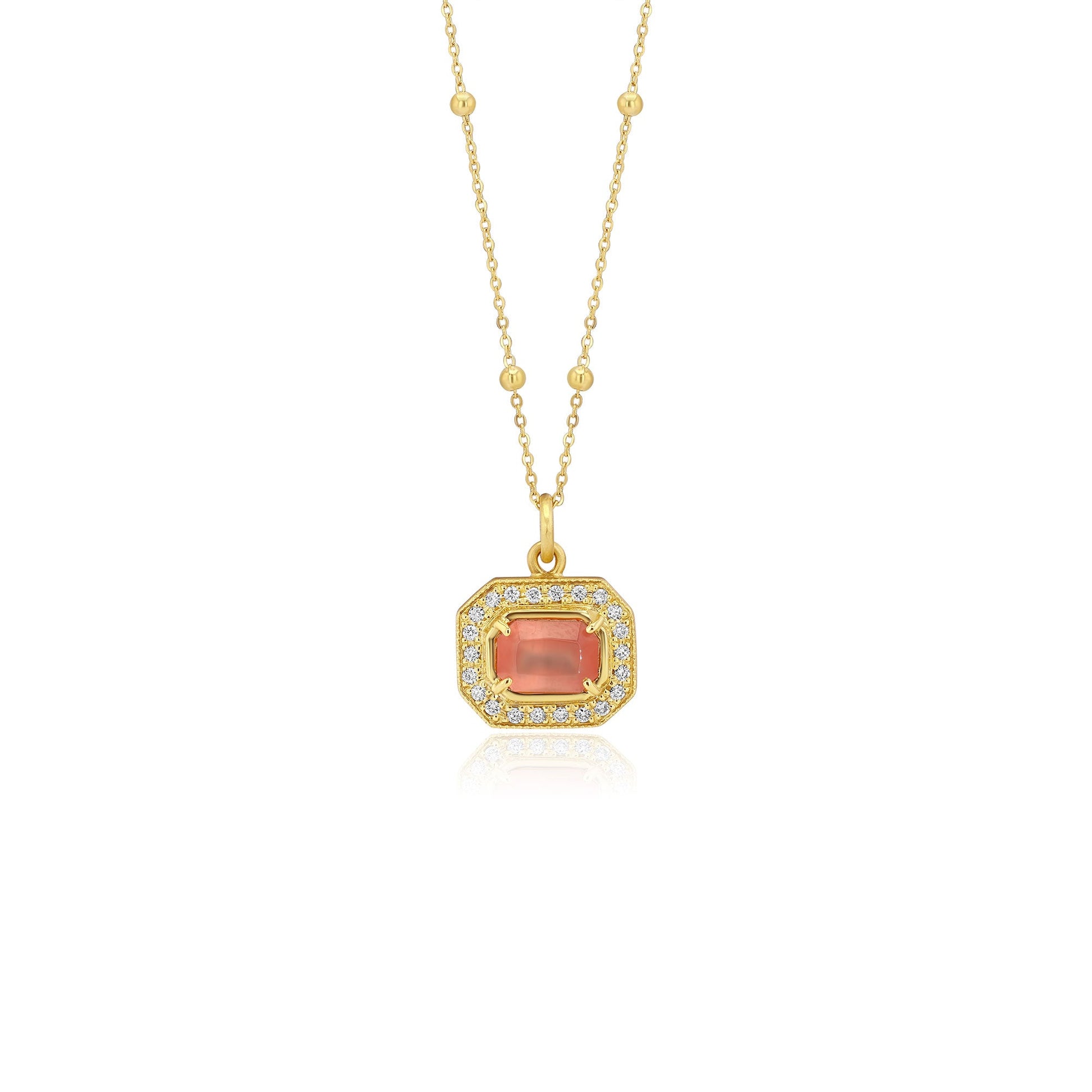 Gold pendant with a central rhodochrosite gemstone with white diamond pave detailing on a white background