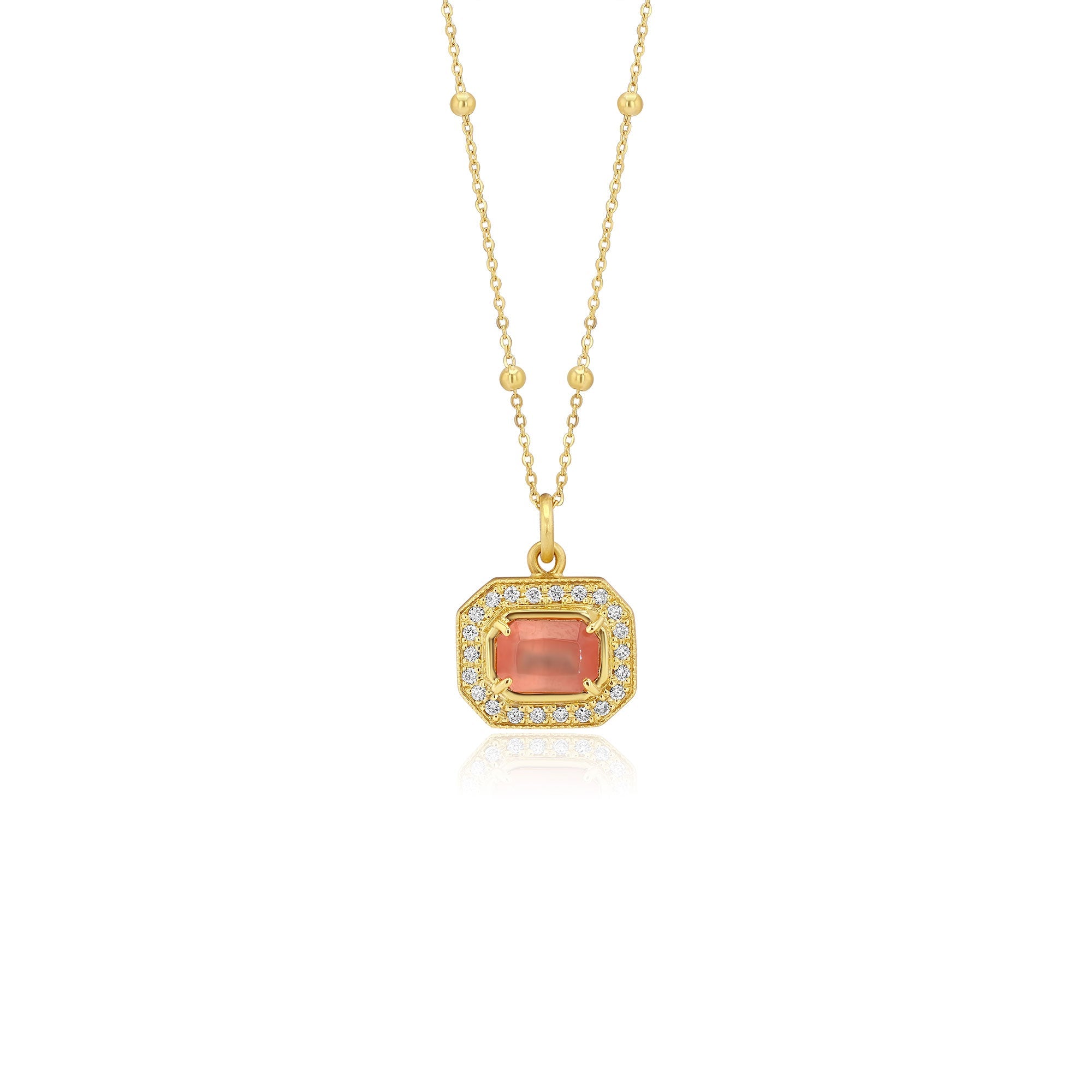 Gold pendant with a central rhodochrosite gemstone with white diamond pave detailing on a white background