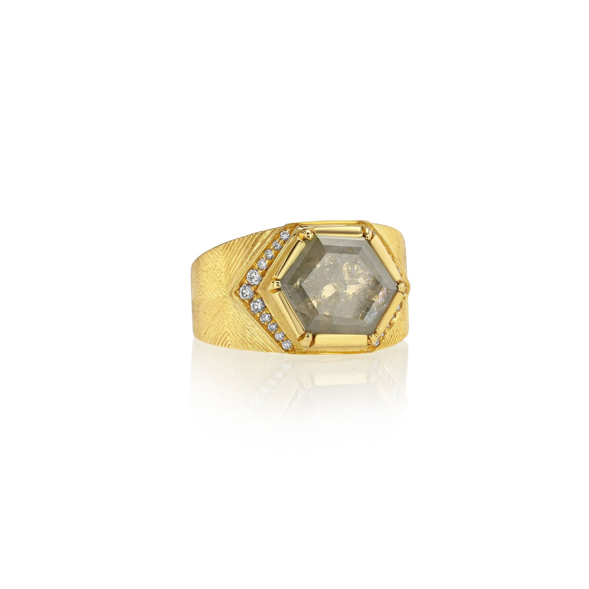 18k gold ring with a large hexagonal raw diamond gemstone and smaller stones on a white background.