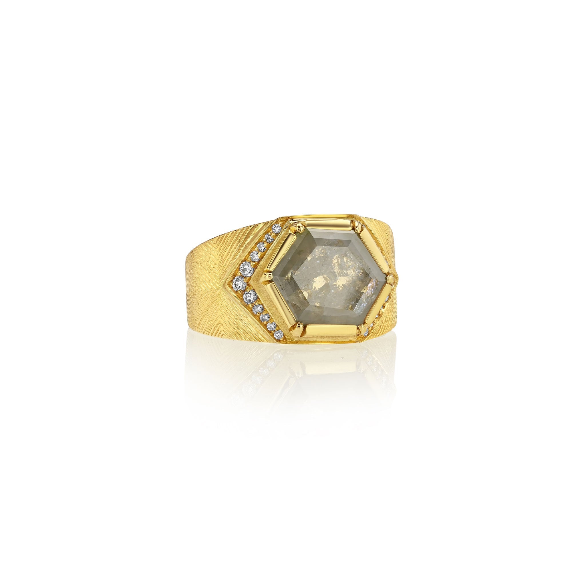 18k gold ring with a large hexagonal raw diamond gemstone and smaller stones on a white background.