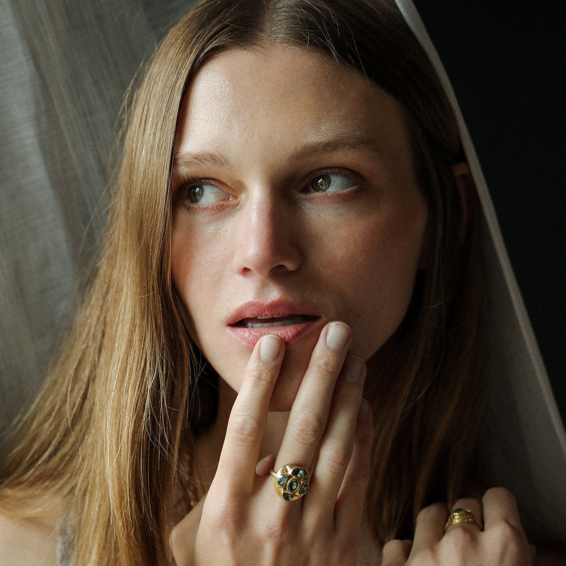 Model wearing One of a kind Indicolite Tourmaline and Sapphire Ring with hand engraving from Los Angeles designer Brooke Gregson handmade in London