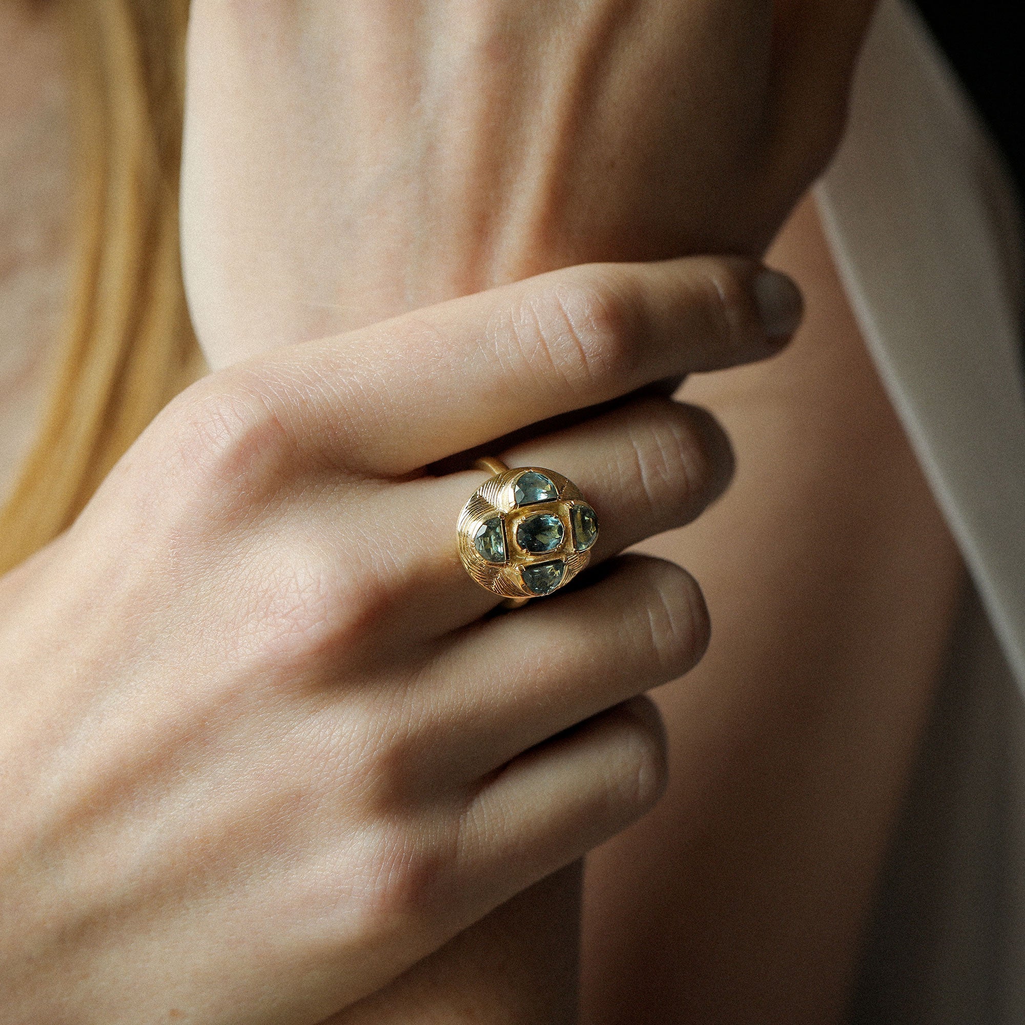 Model wearing One of a kind Indicolite Tourmaline and Sapphire Ring with hand engraving from Los Angeles designer Brooke Gregson handmade in London