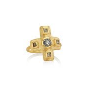 Gold cross ring with raw diamond accents on a white background