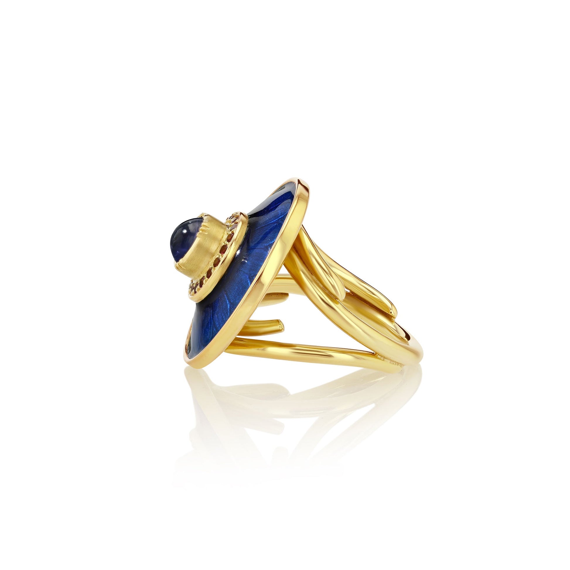 side view  of a 18k gold ring with a sapphire stone on a white background