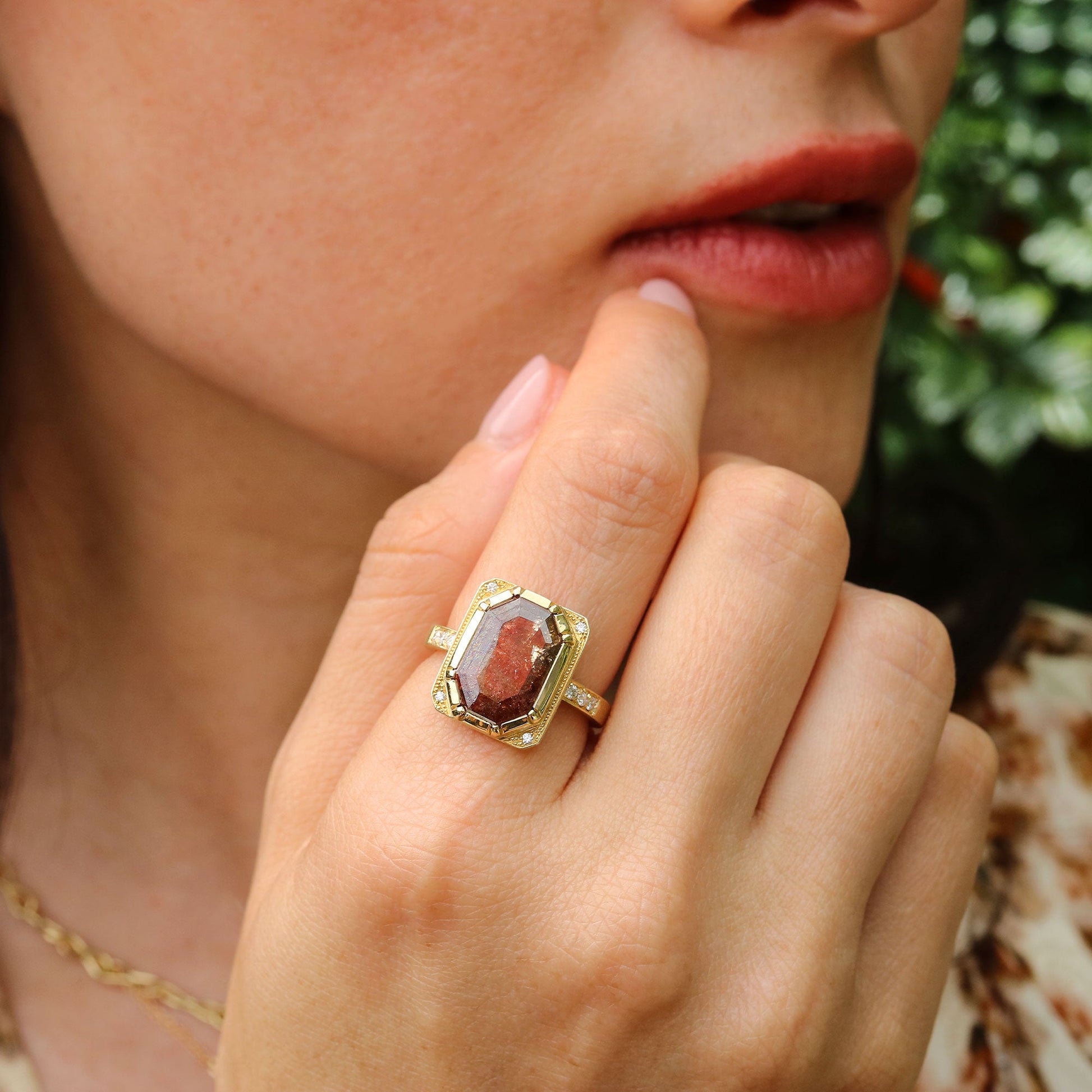 Girl wearing a 18k gold raw diamond ring with white diamond accents by Brooke Gregson Jewelry.