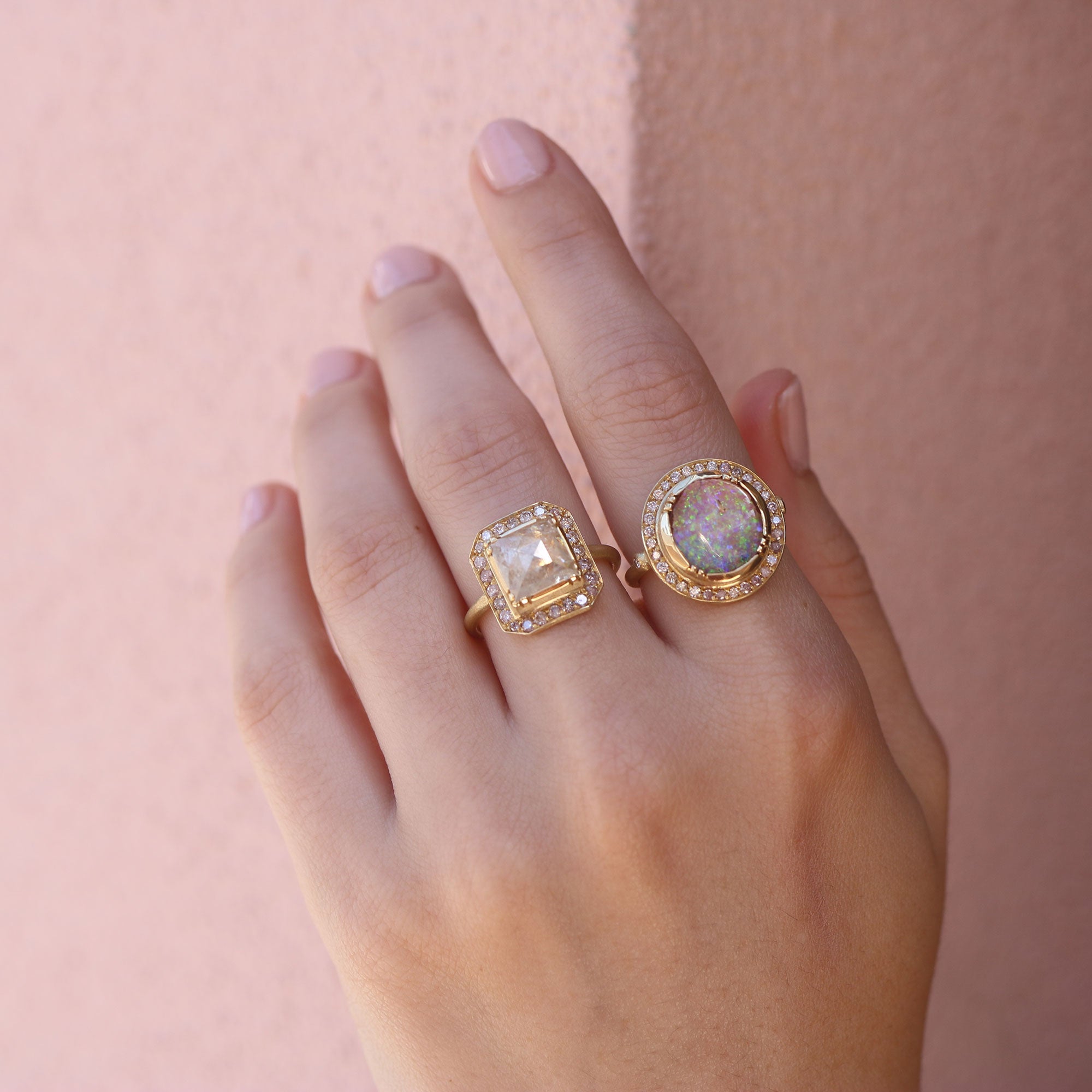 Model wearing one of a kind Boulder Opal ring and raw Diamond ring from Los Angeles designer Brooke Gregson, fine jewelry handmade in London