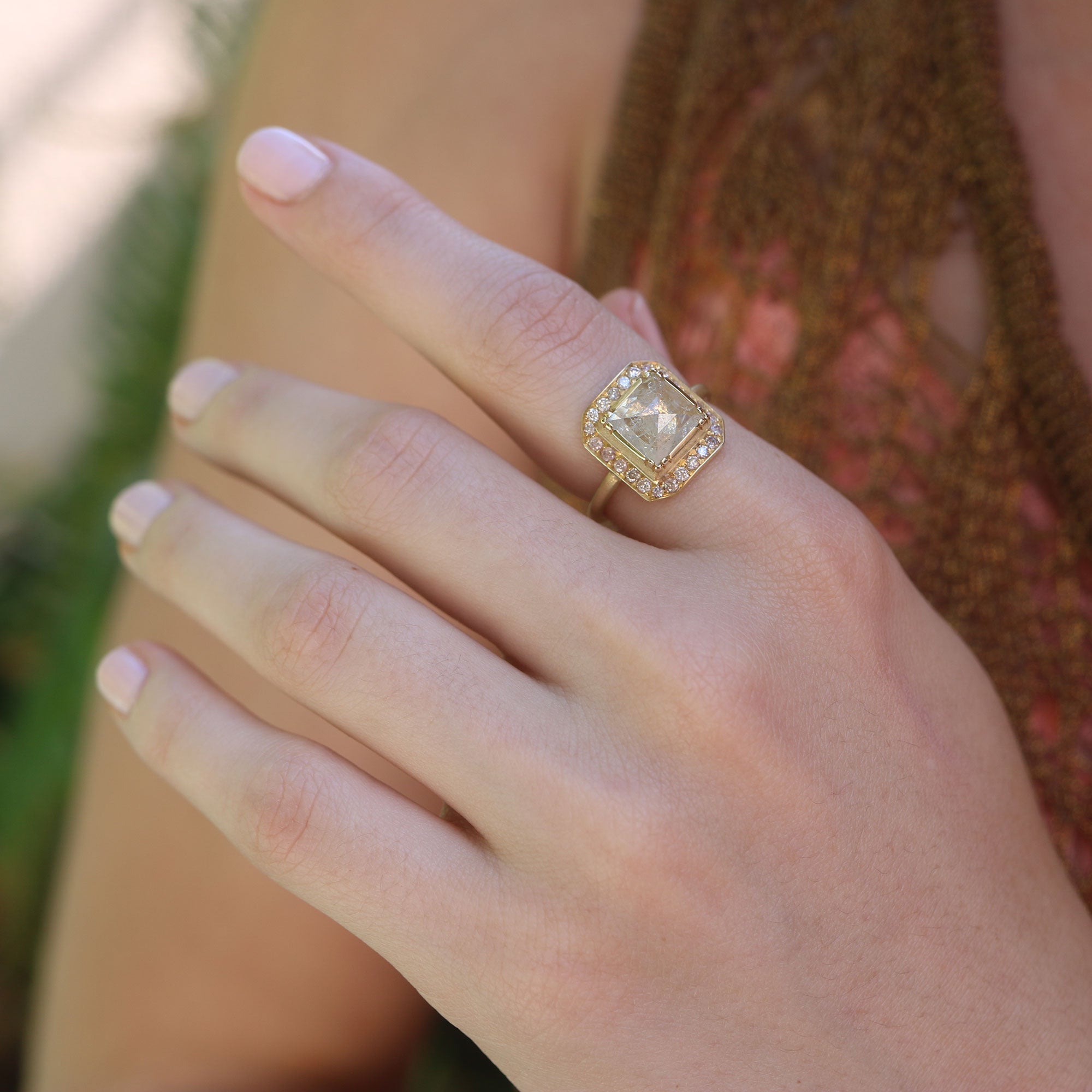 Modl wearing one of a kind raw Diamond ring with pink Diamond pave surround from fine jewelry designer Brooke Gregson handmade in London