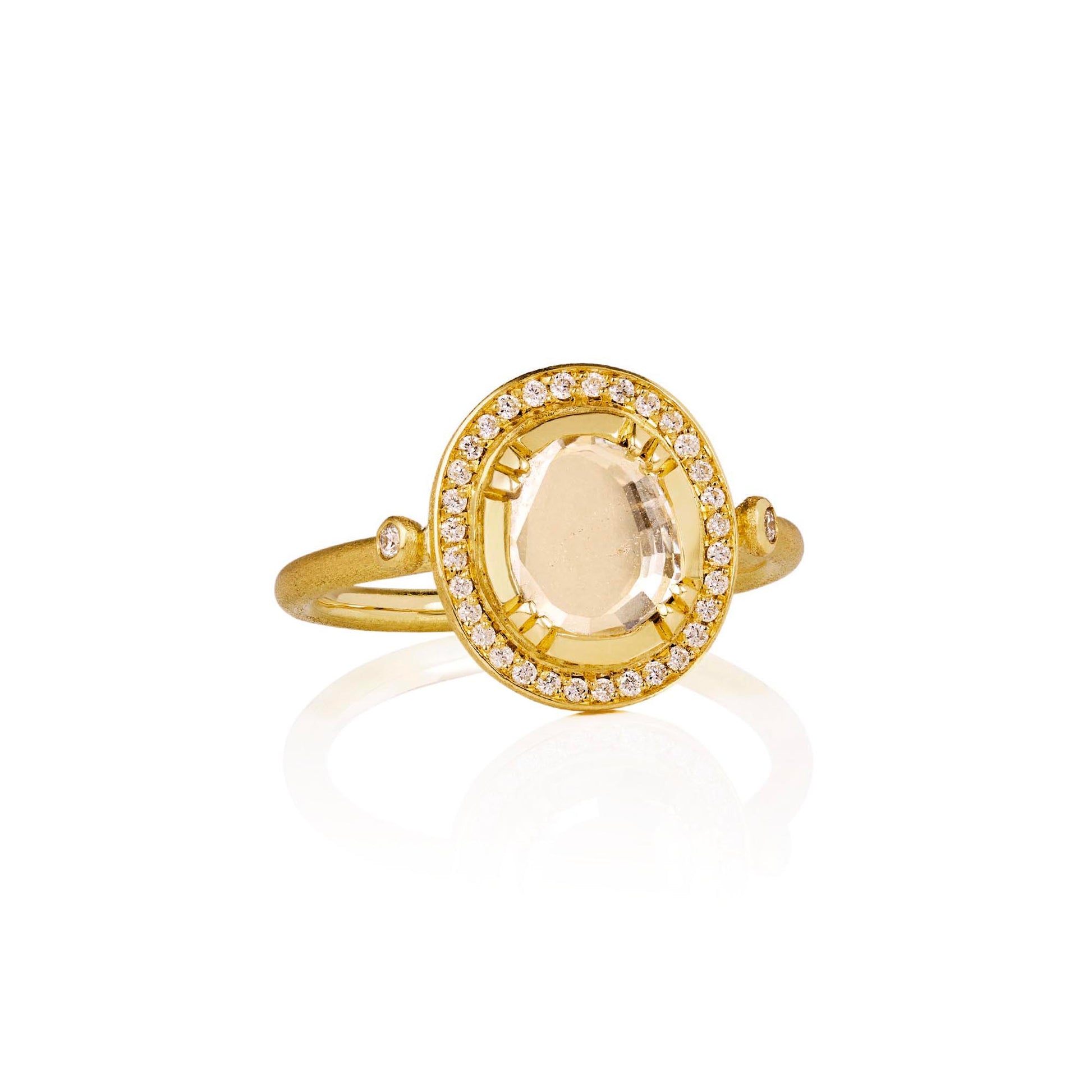 One of a kind 18k gold ring with a central diamond surrounded by a halo of diamond pave from Los Angeles jewelry designer Brooke Gregson handmade in London