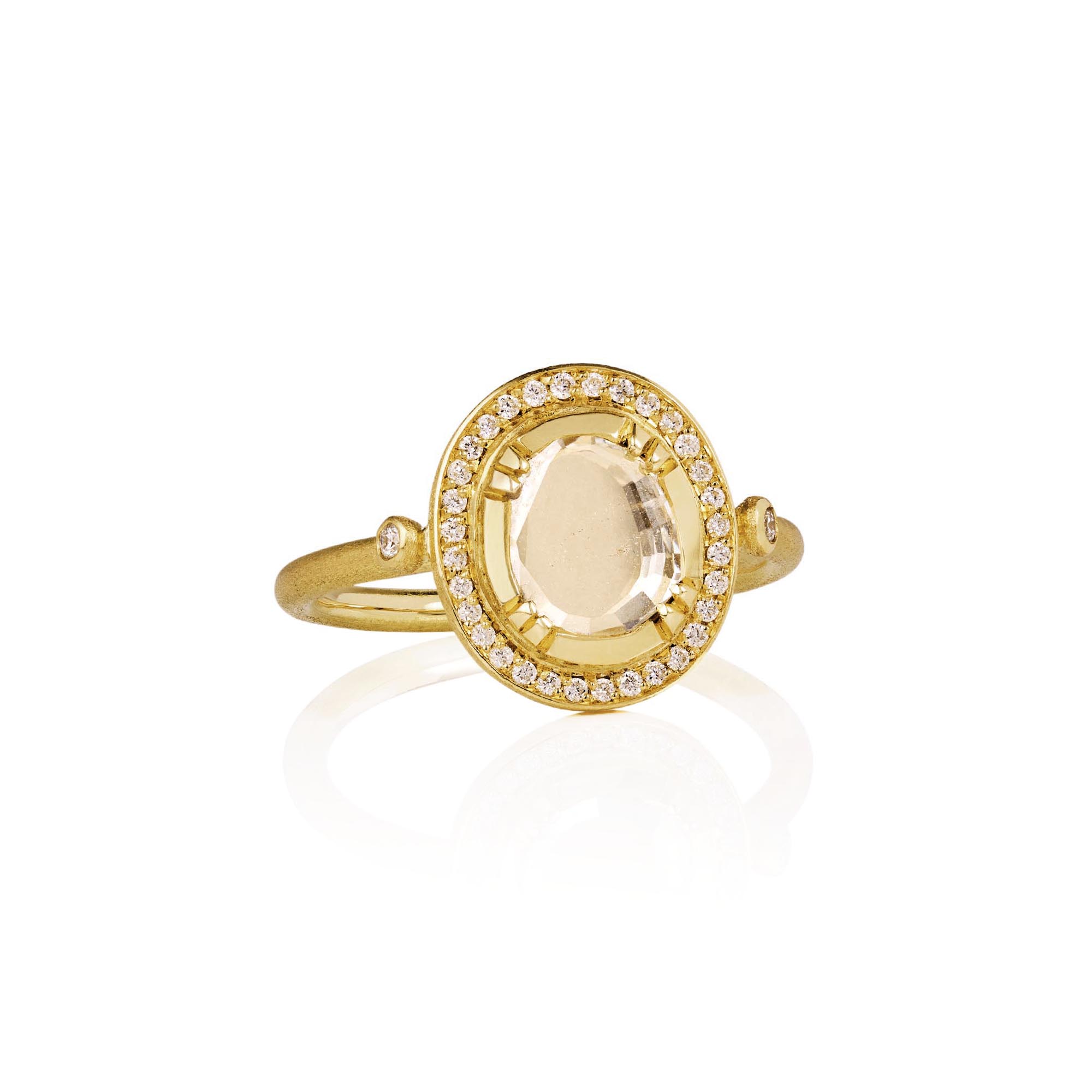 One of a kind 18k gold ring with a central diamond surrounded by a halo of diamond pave from Los Angeles jewelry designer Brooke Gregson handmade in London