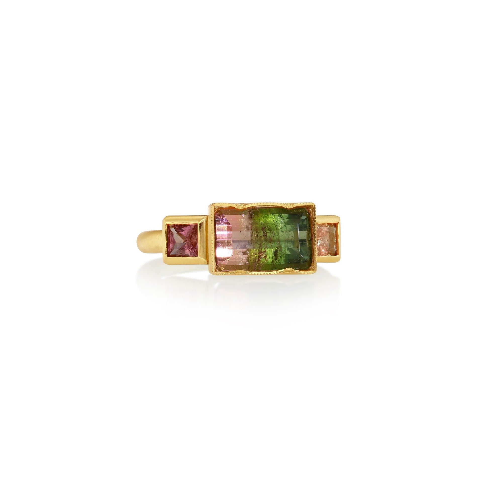 18k gold ring with multicolored bi colour gemstone in the center with pink sapphire accents on a white background