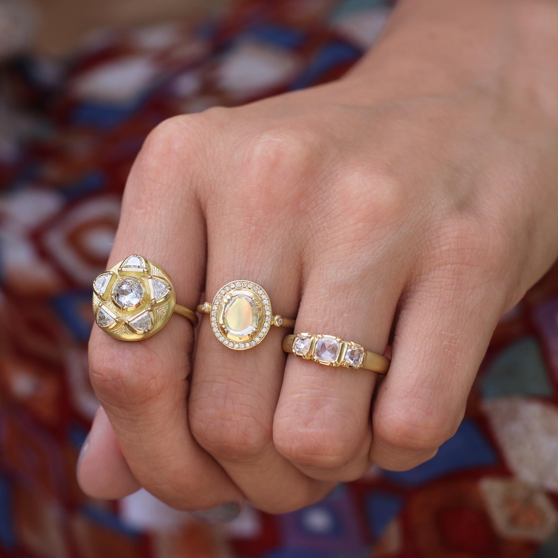 Model wearing multiple diamond rings from Los Angeles jewelry designer Brooke Gregson fine jewelry handmade in London