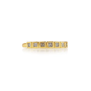 18k gold ring with pink princess cut diamonds on a white background.