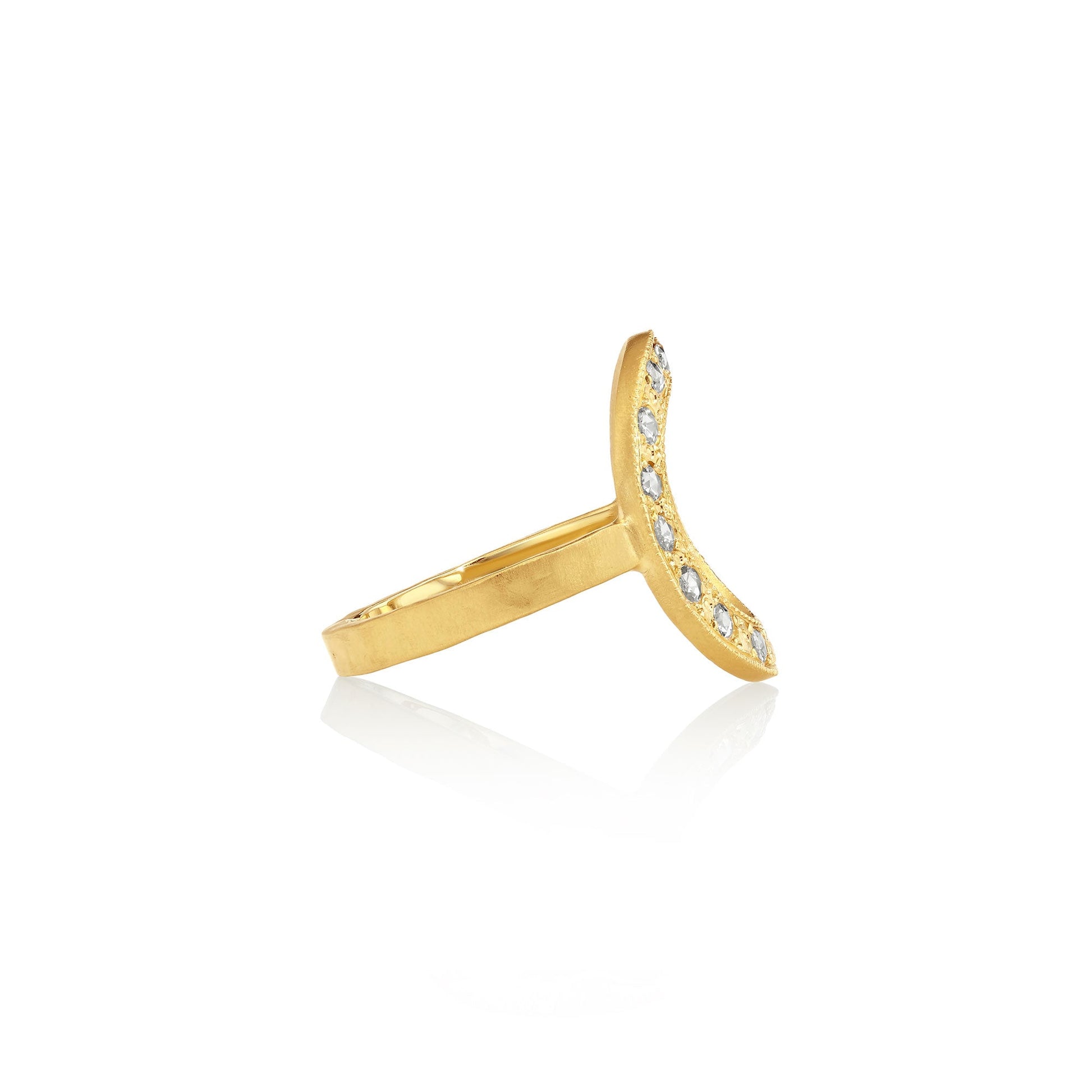 Side profile of a gold ring with white diamonds on a white background