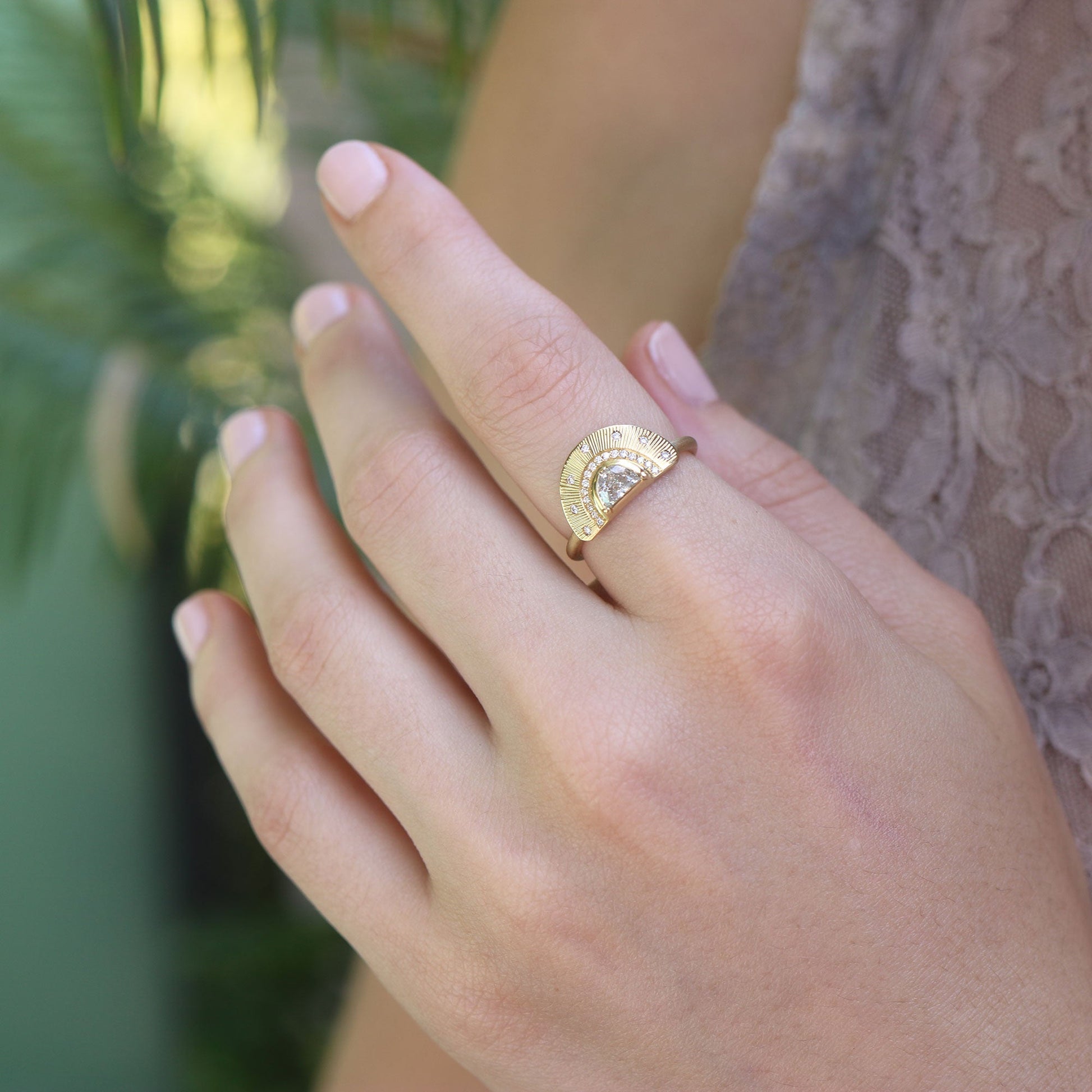 Model wearing one of a kind 18k gold half moon Diamond ring with hand engraving from Los Angeles designer Brooke Gregson fine jewelry handmade in London