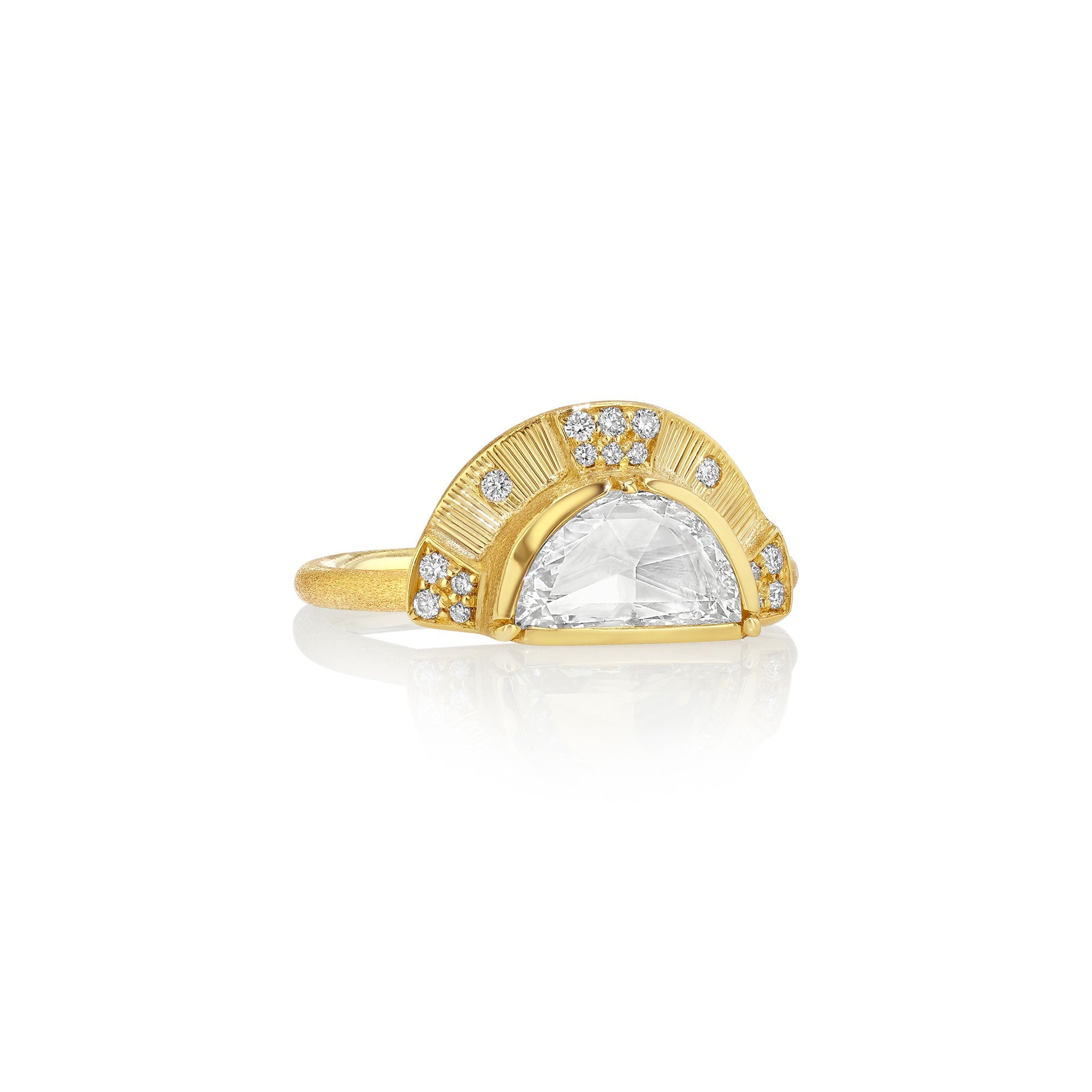 Gold ring with a large central diamond and smaller diamonds on a white background