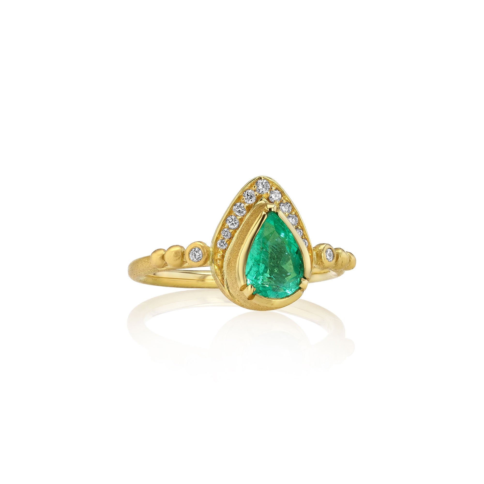 Gold ring with a green teardrop-shaped gemstone on a white background